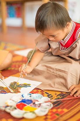 [Photo: A Child Painting]