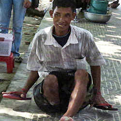 [Photo: Man with Disabilities]