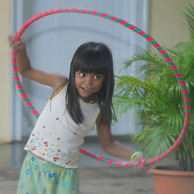 [Photo: Girl with Hula Hoop]